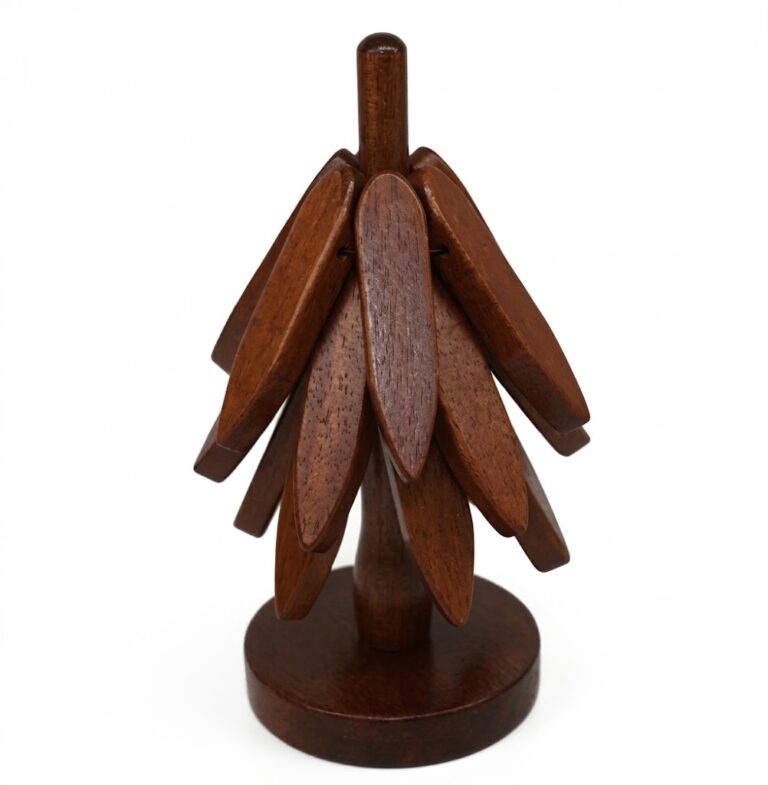Rotating black walnut wood trivet for hot pots and pans with rich dark wood grain